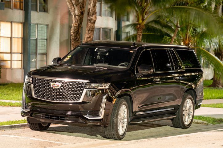 Sunny Isles Beach, FL, USA - October 21, 2021: Night photo of a Cadillac Escalade luxury suv limo used for Uber and Lyft